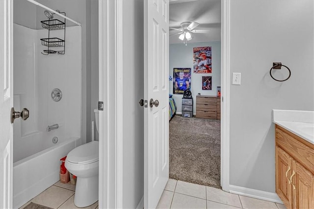 bathroom with tile patterned floors, toilet, vanity, and shower / bathing tub combination