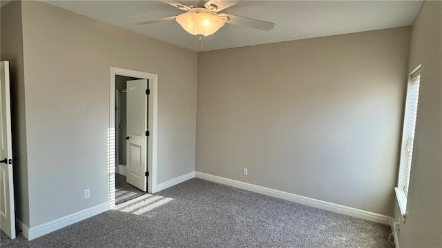 unfurnished bedroom with baseboards, carpet floors, and ceiling fan