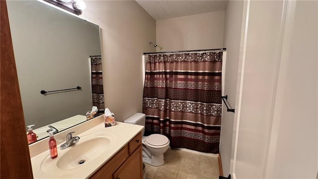 bathroom with a textured ceiling, toilet, vanity, and a shower with curtain