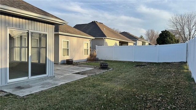 view of yard featuring a patio and a fenced backyard