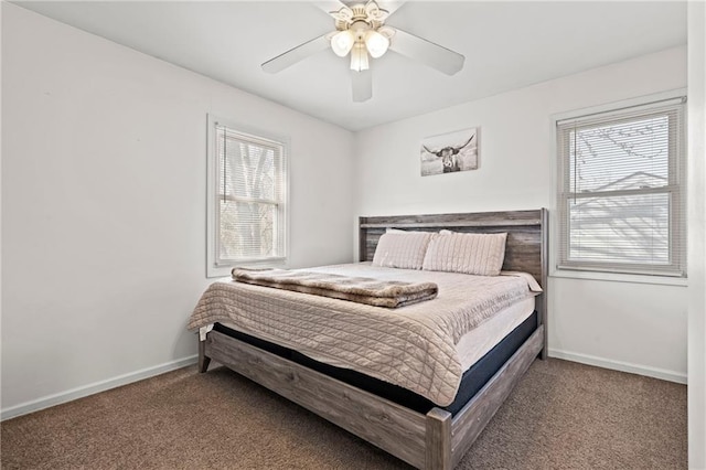 bedroom with carpet flooring, multiple windows, baseboards, and ceiling fan