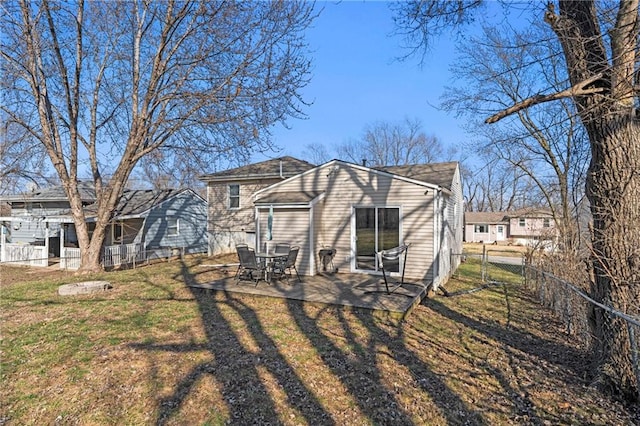 rear view of house featuring a yard, fence, and a patio area