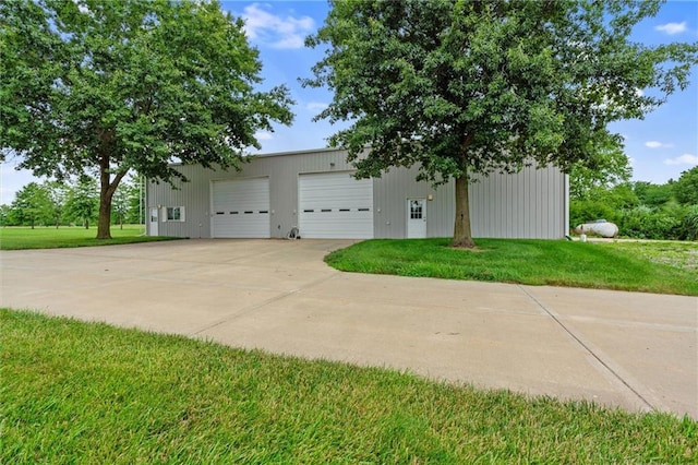 17701 C Hwy, Trimble, MO 64492 - view of side of property featuring a garage, an outbuilding, and a lawn