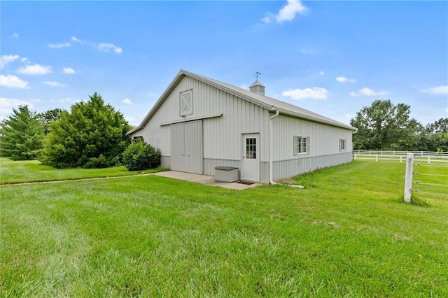 17701 C Hwy, Trimble, MO 64492 - view of home's exterior with a detached garage, a pole building, an outdoor structure, and a chimney