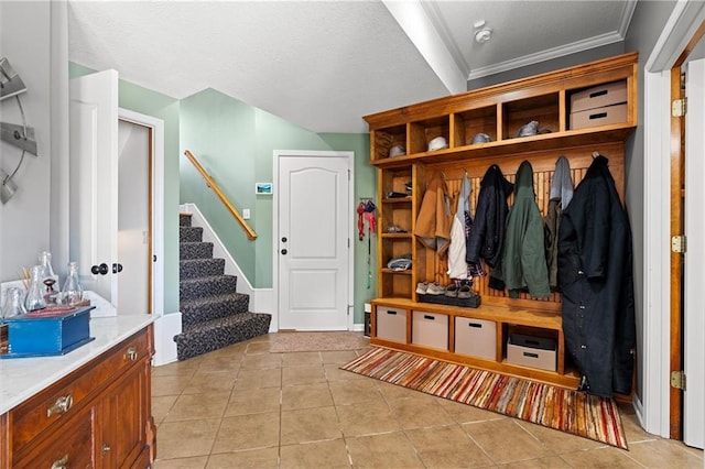 17701 C Hwy, Trimble, MO 64492 - mudroom featuring light tile patterned floors and ornamental molding