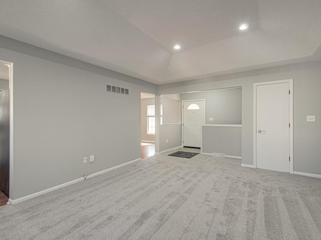 interior space featuring recessed lighting, visible vents, carpet flooring, and baseboards