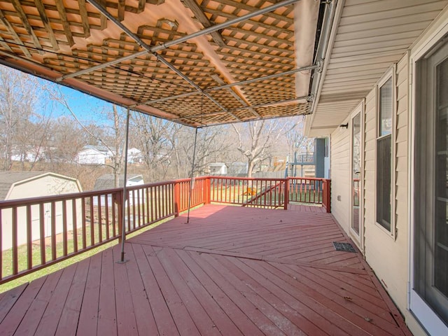 wooden deck featuring an outdoor structure