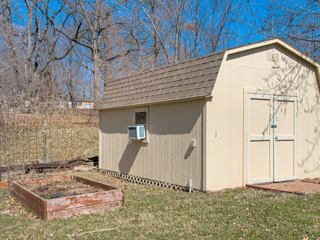 view of shed featuring cooling unit and a garden