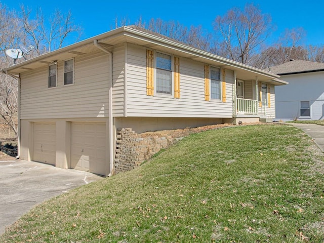 view of front facade featuring a garage, driveway, a porch, and a front lawn