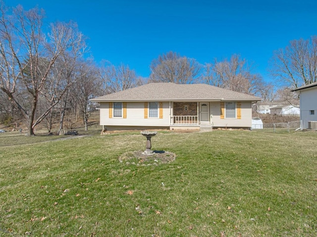 ranch-style home with a front lawn, a porch, and fence