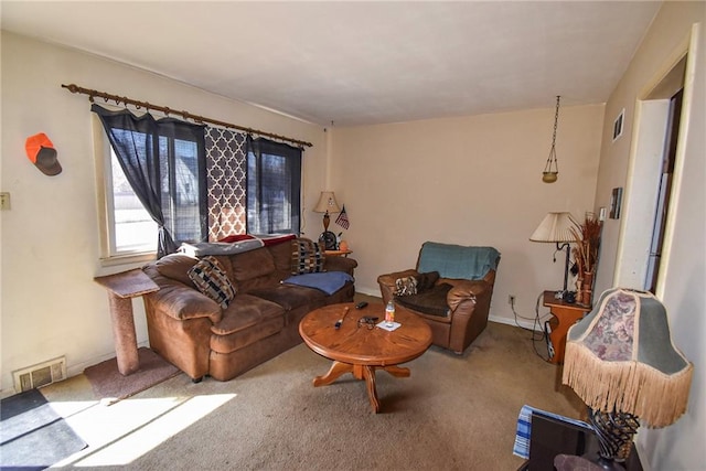 carpeted living area featuring visible vents