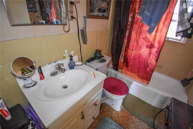 bathroom with shower / bath combo with shower curtain, toilet, tile walls, and vanity