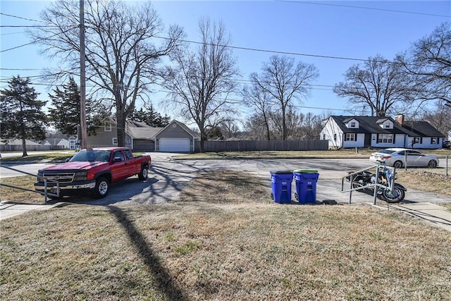 view of yard with a garage and fence