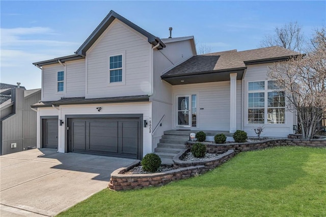 view of front facade featuring driveway, a front lawn, and a garage