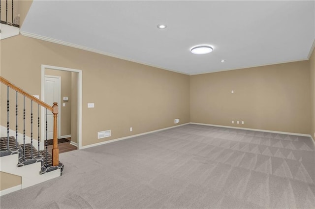 unfurnished room featuring visible vents, ornamental molding, stairway, carpet, and baseboards