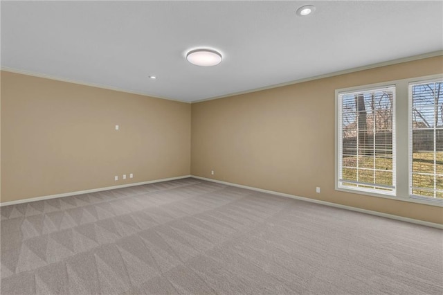 unfurnished room featuring light carpet, recessed lighting, crown molding, and baseboards