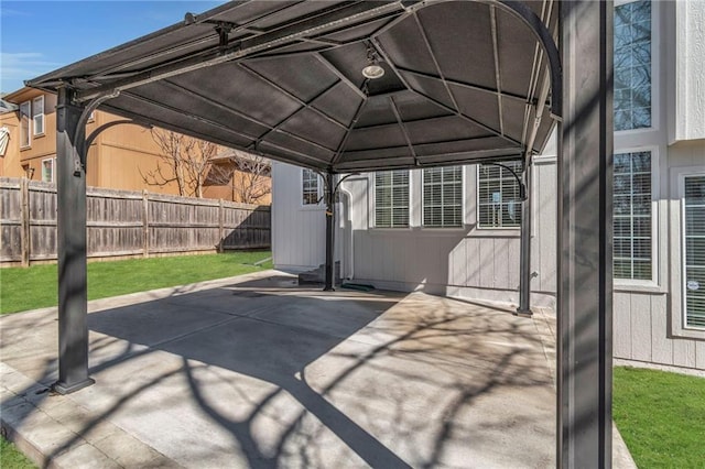 view of patio featuring a gazebo and fence