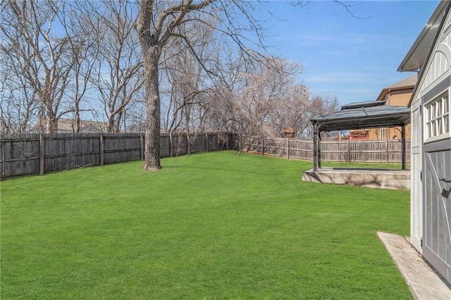 view of yard with a gazebo and a fenced backyard