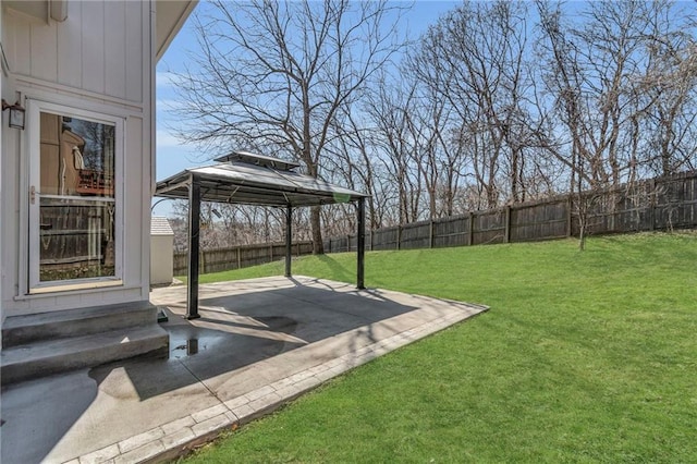 view of yard featuring a gazebo, entry steps, a fenced backyard, and a patio area