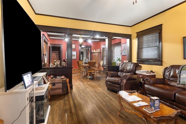 209 High St, Platte City, MO 64079 - living area featuring crown molding, ornate columns, and wood finished floors