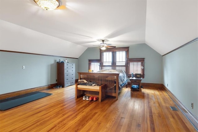 209 High St, Platte City, MO 64079 - bedroom with visible vents, baseboards, wood-type flooring, lofted ceiling, and ceiling fan