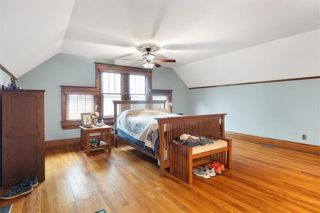 209 High St, Platte City, MO 64079 - bedroom featuring vaulted ceiling, light wood-style flooring, and baseboards