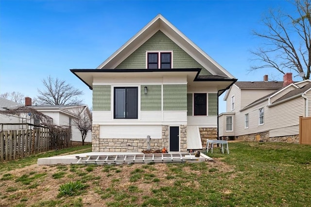 209 High St, Platte City, MO 64079 - rear view of property featuring a yard and fence