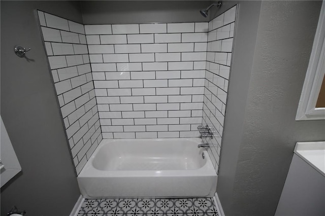 bathroom with baseboards,  shower combination, and tile patterned flooring