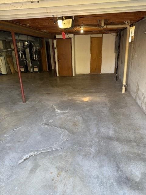 1507 W Concord Dr, Plattsburg, MO 64477 - garage with water heater, a garage door opener, and heating unit