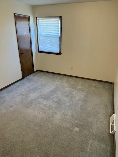 1507 W Concord Dr, Plattsburg, MO 64477 - spare room with baseboards and carpet flooring