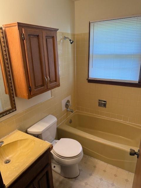 1507 W Concord Dr, Plattsburg, MO 64477 - full bath with tasteful backsplash, vanity, toilet, washtub / shower combination, and tile walls