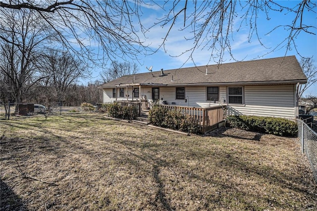 1507 W Concord Dr, Plattsburg, MO 64477 - rear view of house featuring a shingled roof, a yard, a fenced backyard, and a deck