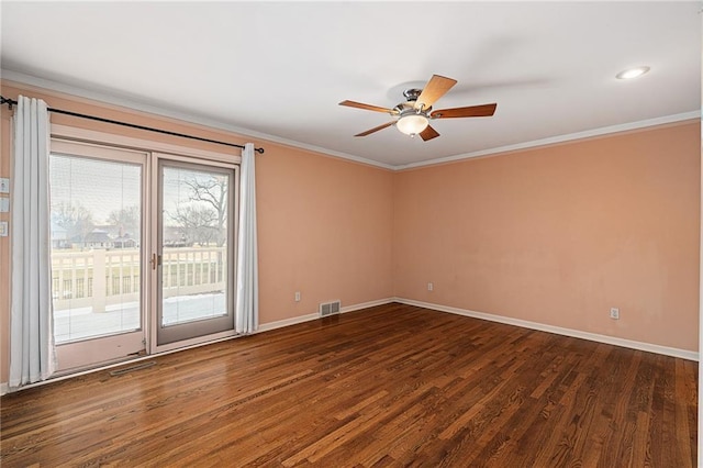 empty room featuring ceiling fan, baseboards, dark wood-style flooring, and ornamental molding