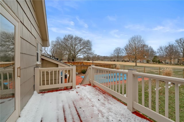 wooden deck featuring a fenced backyard