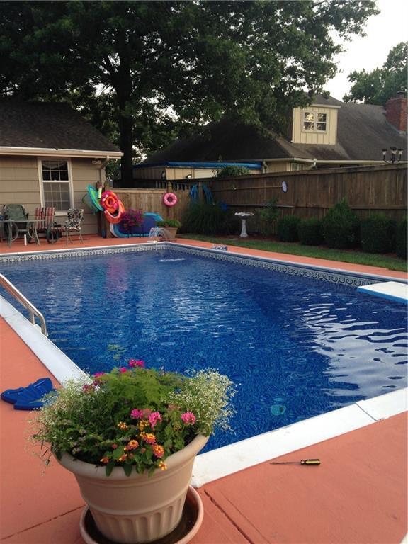 view of swimming pool featuring a fenced in pool, a patio, and fence