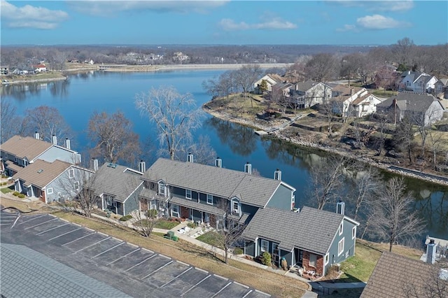 birds eye view of property with a residential view and a water view