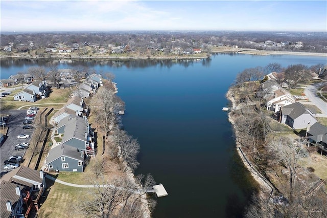 drone / aerial view with a residential view and a water view