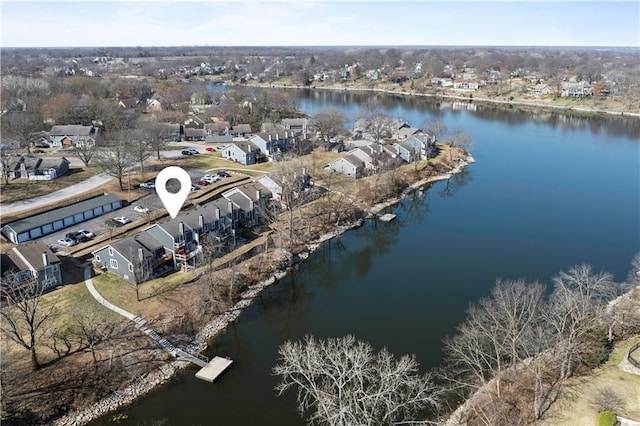 drone / aerial view featuring a water view and a residential view