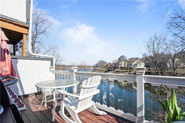 wooden terrace with outdoor dining space