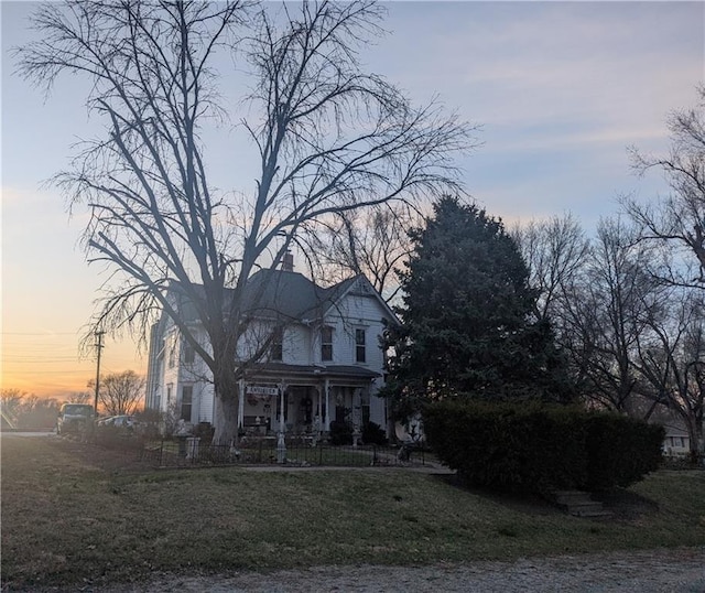 view of front of house with a front lawn and a chimney