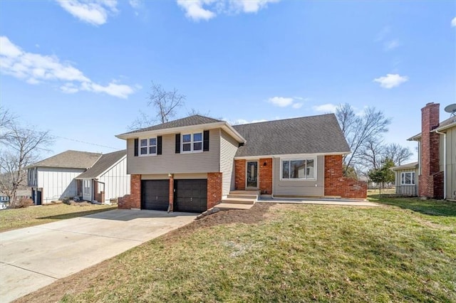 tri-level home featuring driveway, brick siding, an attached garage, and a front yard