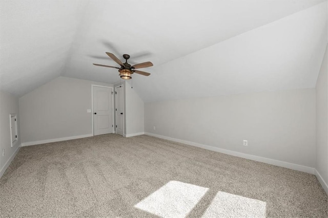 bonus room featuring carpet floors, ceiling fan, baseboards, and vaulted ceiling