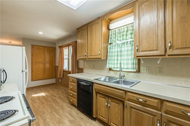 kitchen featuring light wood-type flooring, brown cabinets, a sink, white appliances, and light countertops