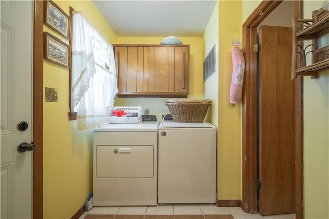 washroom with visible vents, cabinet space, separate washer and dryer, light tile patterned floors, and baseboards