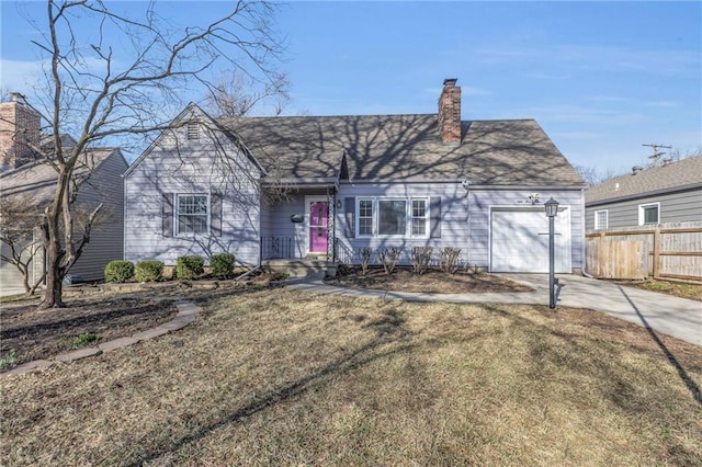 view of front of property with a front yard, fence, an attached garage, a chimney, and concrete driveway