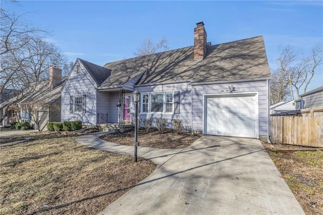 view of front of house with a garage, concrete driveway, a chimney, and fence