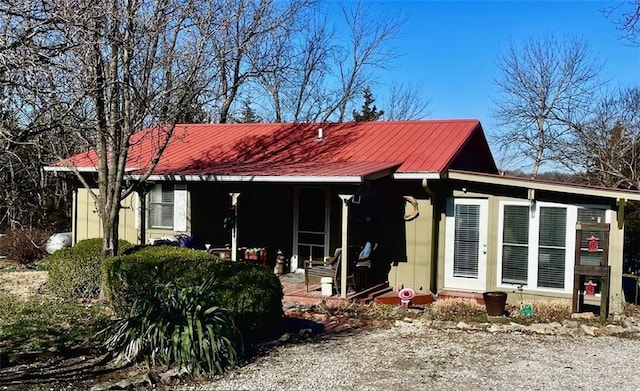 view of front facade with a porch and metal roof