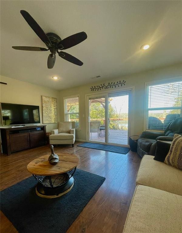 living room featuring recessed lighting, a ceiling fan, and dark wood-style flooring