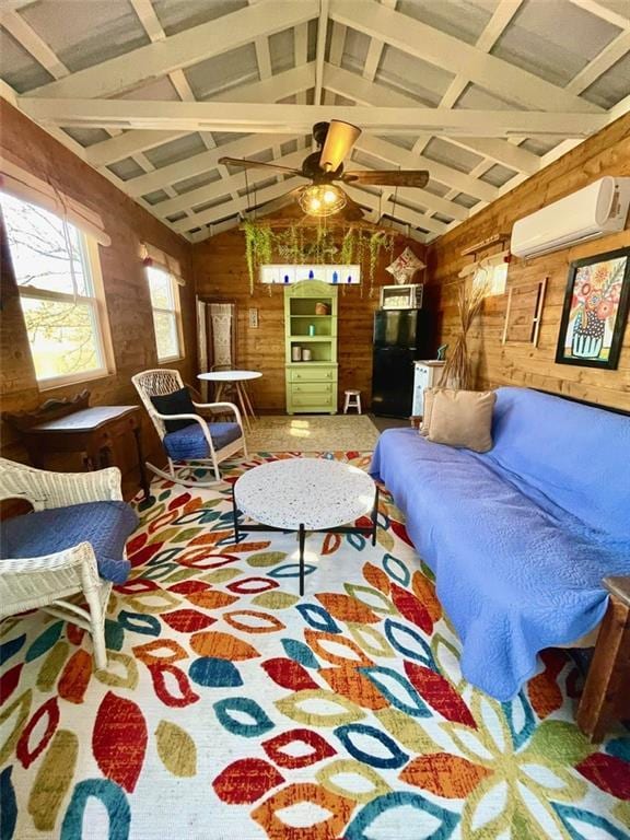 living area featuring vaulted ceiling with beams, wooden walls, a wall mounted air conditioner, and ceiling fan