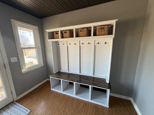 mudroom featuring baseboards and wood finished floors